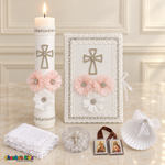 Pink Floral Cross Baptism Set (Spanish), all six pieces arranged with a lit candle, Bible, shell, rosary case, scapular and handkerchief