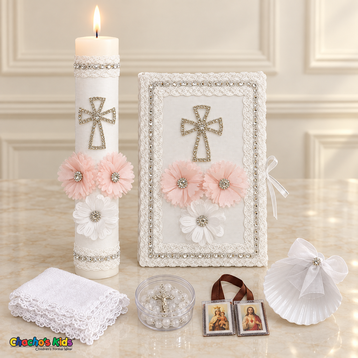 Pink Floral Cross Baptism Set (Spanish), all six pieces arranged with a lit candle, Bible, shell, rosary case, scapular and handkerchief