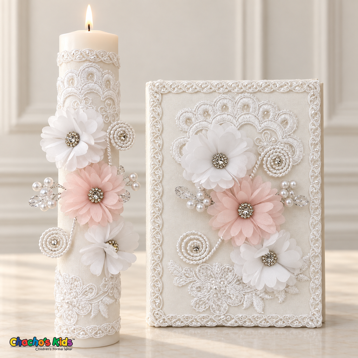 Lit baptism candle and matching Spanish prayer book with pink and white flowers, pearl accents and embroidered lace